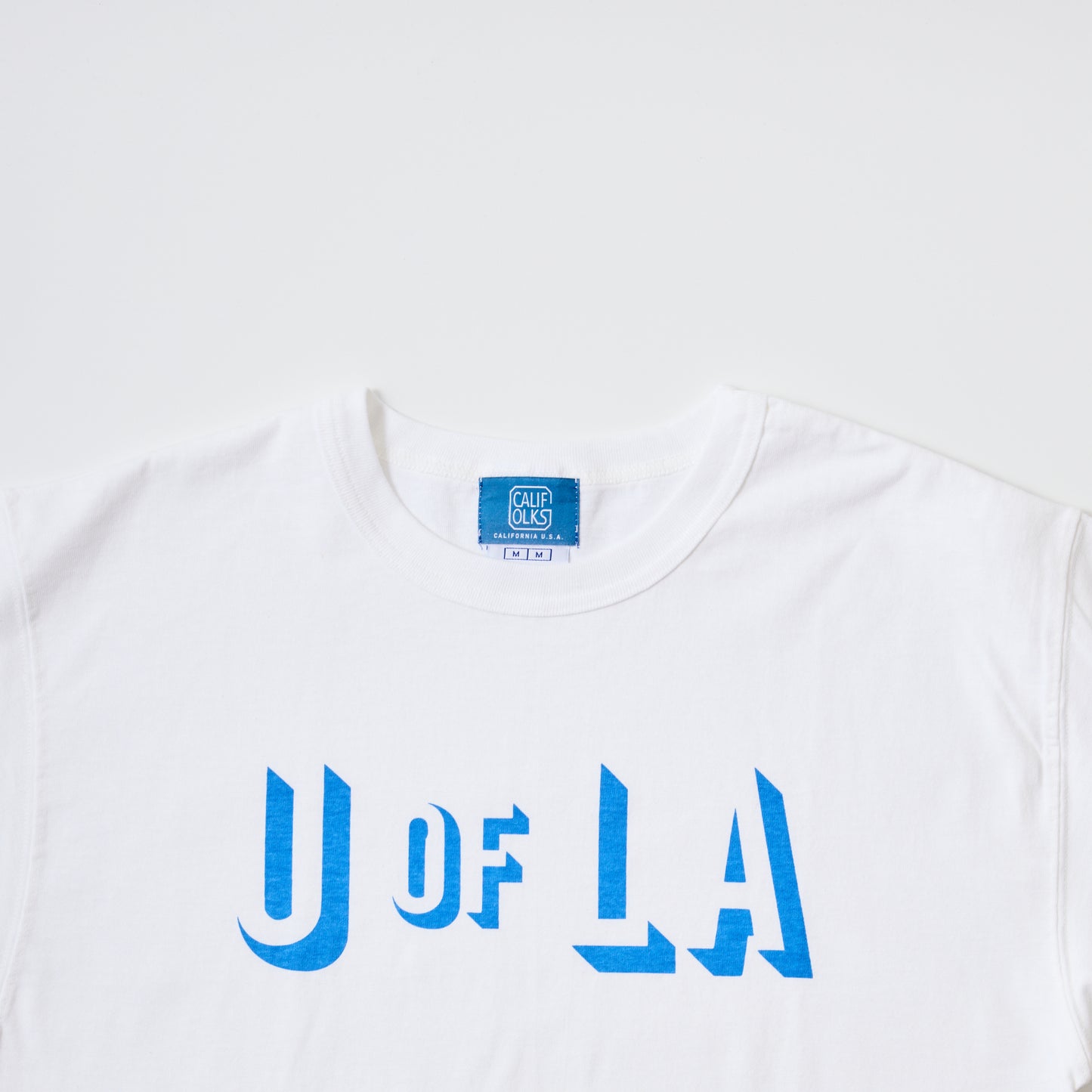 CALIFOLKS CHAMPION HERITAGE TEE - U OF LA