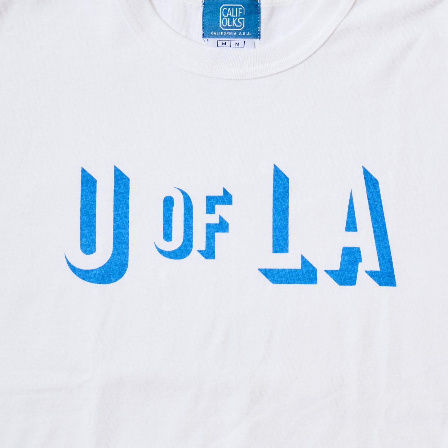 CALIFOLKS CHAMPION HERITAGE TEE - U OF LA